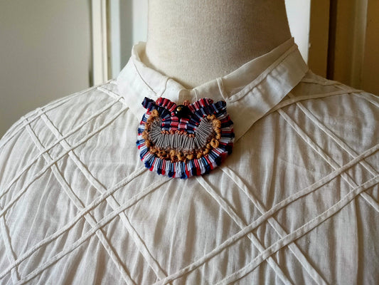 Broche en tissu plif tripot